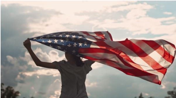 Person holding a United States flag