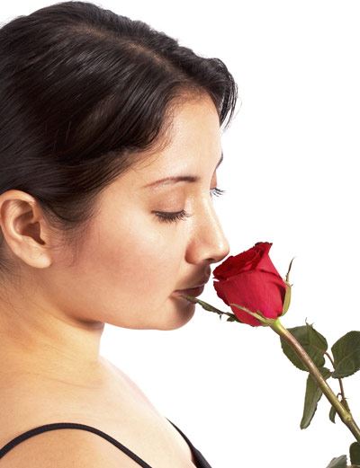 Woman Smelling Rose